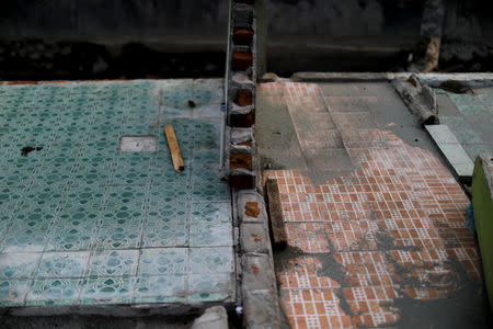 Floor tiles of destroyed houses, located near a beach hit by a tsunami, are seen in Palu, Central Sulawesi, Indonesia, October 13, 2018. REUTERS/Jorge Silva