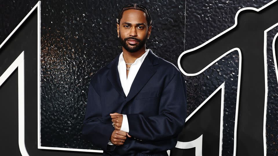 Big Sean looked suave in a loose-fitting dark suit. - Jamie McCarthy/WireImage/Getty Images