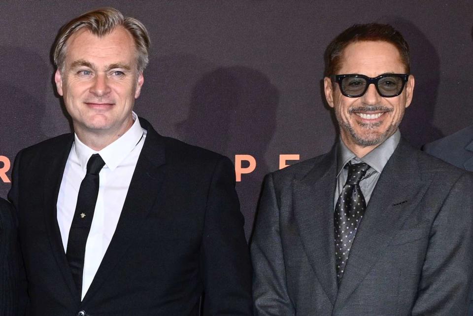 <p>Gareth Cattermole/Getty </p> Christopher Nolan and Robert Downey Jr. on July 13, 2023