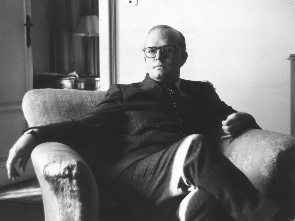 A black and white photo of Truman Capote