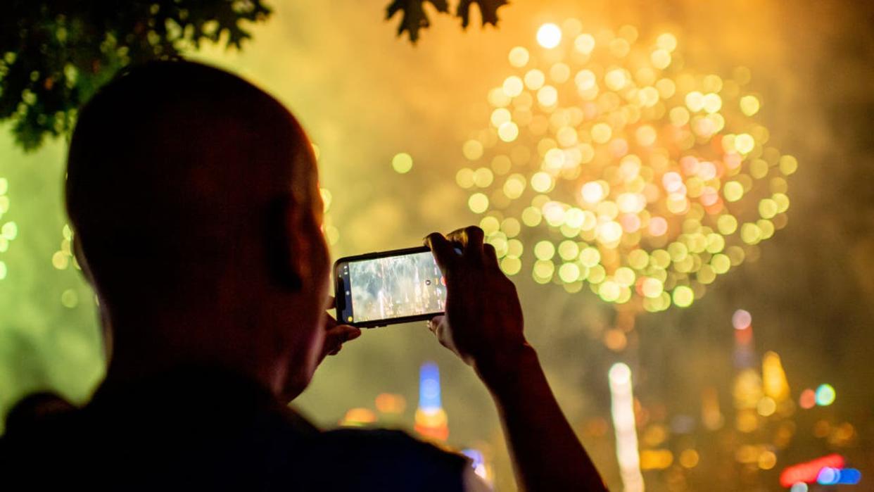 <div>NEW YORK, NEW YORK - JULY 04: Spectators gather at Gantry Plaza State Park in Queens to watch to 2022 Macy's fireworks display on July 04, 2022 in New York City. (Photo by Roy Rochlin/Getty Images)</div>