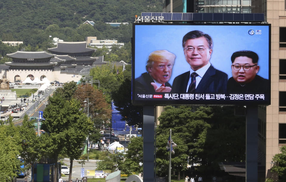 FILE - In this Sept. 5, 2018, file photo, a TV screen shows images of North Korean leader Kim Jong Un, right, South Korean President Moon Jae-in, center, and U.S. President Donald Trump to advertise upcoming Seoul Defense Dialogue in Seoul, South Korea. President Moon faces his toughest challenge yet in his third summit with Kim in Pyongyang, where he will be pressed to deliver substantive agreements beyond the vague aspirational statements on denuclearization that have been repeated in past months. (AP Photo/Ahn Young-joon, File)