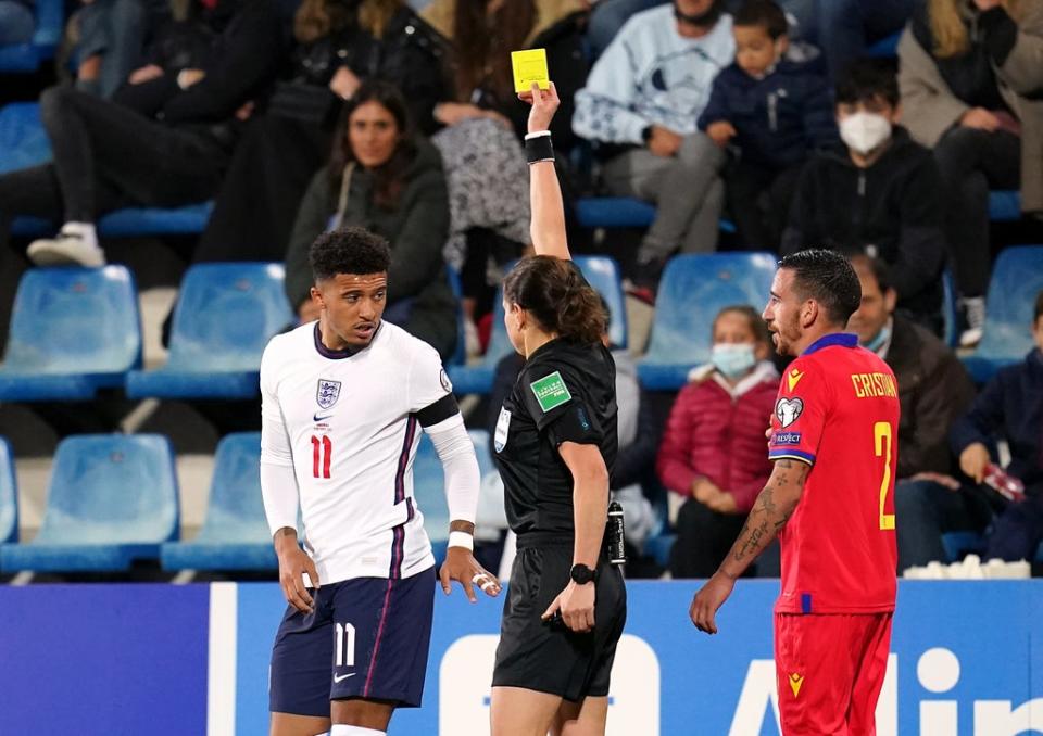 Kateryna Monzul shows a yellow card to Jadon Sancho (Nick Potts/PA) (PA Wire)