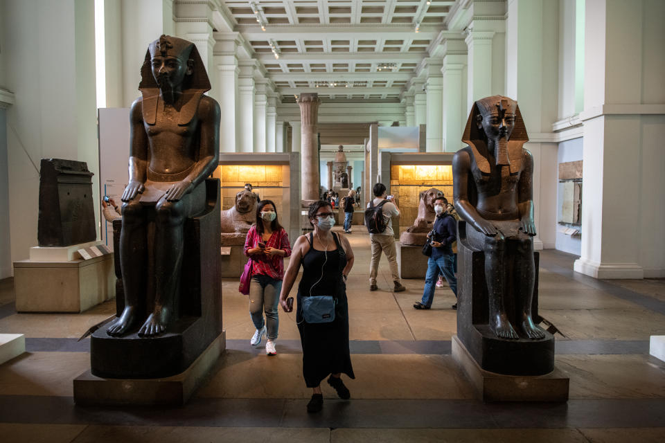 LONDON, ENGLAND - AUGUST 27: Visitors wearing face masks walk through the Egyptian exhibit at the British Museum on August 27, 2020 in London, England. The British Museum has reopened to the public after being closed for 163 days due to Covid-19 restrictions and lockdown. Many other museums have already reopened in the United Kingdom with safety precautions in place to help prevent the spread of Covid-19. (Photo by Chris J Ratcliffe/Getty Images)