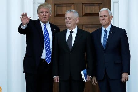 U.S. President-elect Donald Trump (L) and Vice President-elect Mike Pence (R) greet retired Marine General James Mattis for a meeting at the main clubhouse at Trump National Golf Club in Bedminster, New Jersey, U.S., November 19, 2016. REUTERS/Mike Segar
