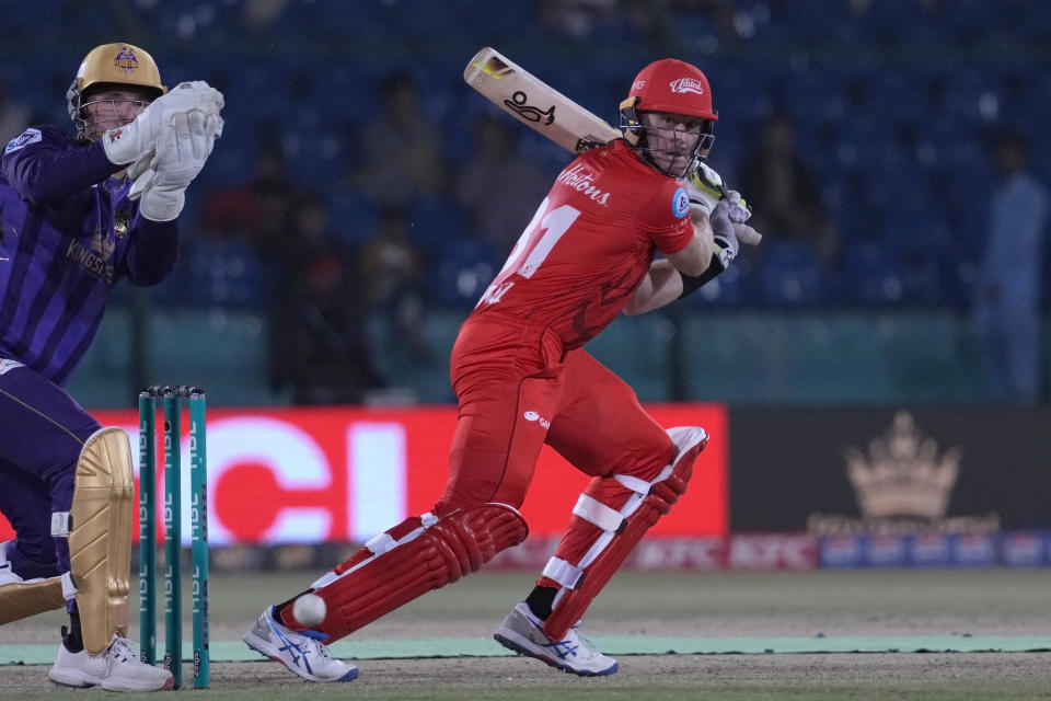 Islamabad United' Martin Guptill, right, plays a shot during the Pakistan Super League T20 cricket eliminator match between Islamabad United and Quetta Gladiators, in Karachi, Pakistan, Friday, March 15, 2024. (AP Photo/Fareed Khan)