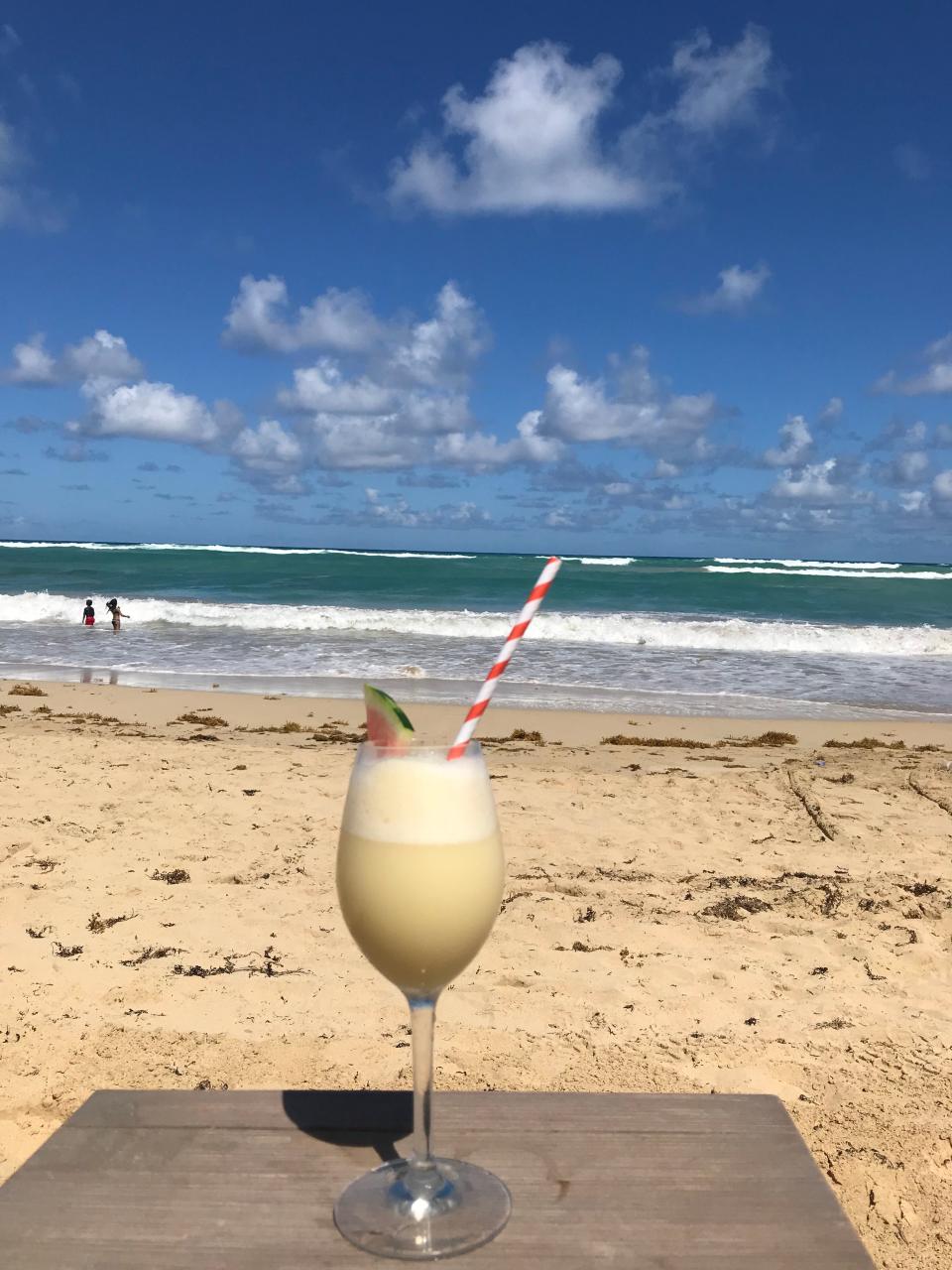 A Pina Colada is served on the beach at the Nickelodeon Hotel.