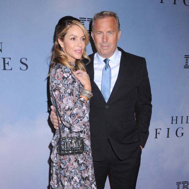 Kevin Costner's estranged wife wears Prada purse after begging