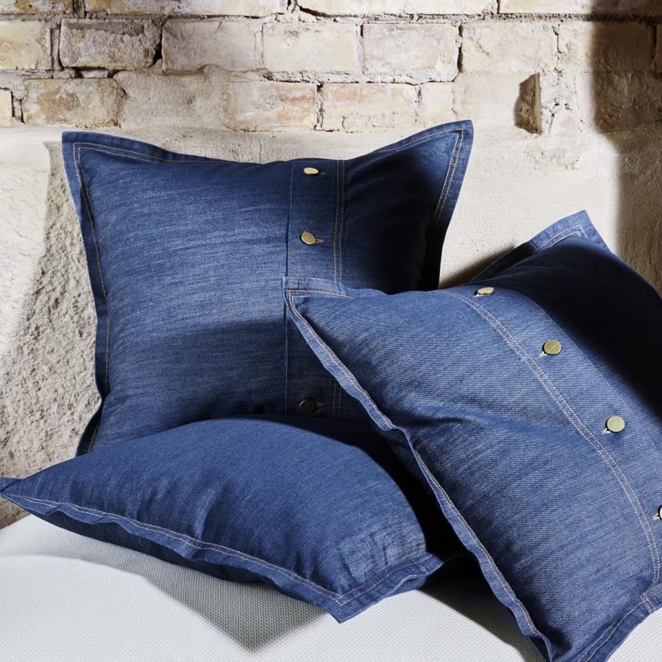 Britney and J.T. in head-to-toe denim is forever "relationship goals." So, applying the same look to your bed will likely spark a similar feeling of adoration. Plus, these denim cushion covers are dyed in a process that actually saves water and energy, and reduces the CO2 footprint—who can argue with that? <a rel="nofollow noopener" href="https://www.ikea.com/" target="_blank" data-ylk="slk:SHOP NOW;elm:context_link;itc:0;sec:content-canvas" class="link ">SHOP NOW</a>: SISSIL cushion cover by IKEA, $16.99, ikea.com.