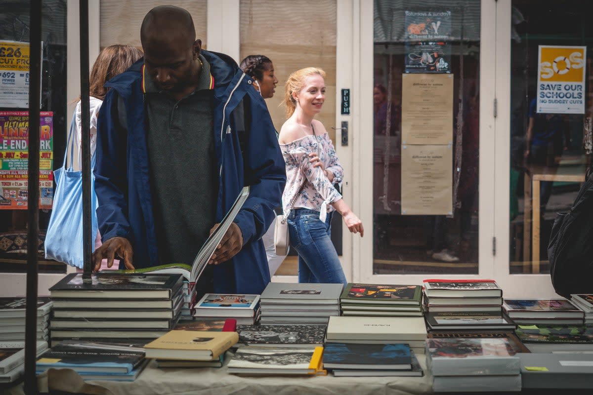 Amid the street food, stalls sell vintage books in Broadway Market, Hackney (Getty Images)