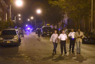 <p>Baltimore police, from left, Deputy Commissioner Dean Palmere, Commissioner Kevin Davis, Stanley Brandford, chief of detectives, and T.J. Smith, police spokesman, walk at a scene where multiple people were shot and wounded in Baltimore, Saturday night, Sept. 24, 2016. The shooting erupted outside some rowhouses about 8:30 p.m. after the three armed men converged on the group from different points, Baltimore Police Commissioner Davis told The Associated Press. (AP Photo/Steve Ruark)</p>