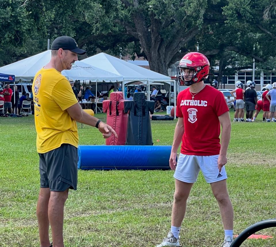 Saints co-defensive coordinator Ryan Nielsen (left) instructs a high school football player during the Louisiana Line Camp held at Nicholls in Thibodaux from June 18-21.