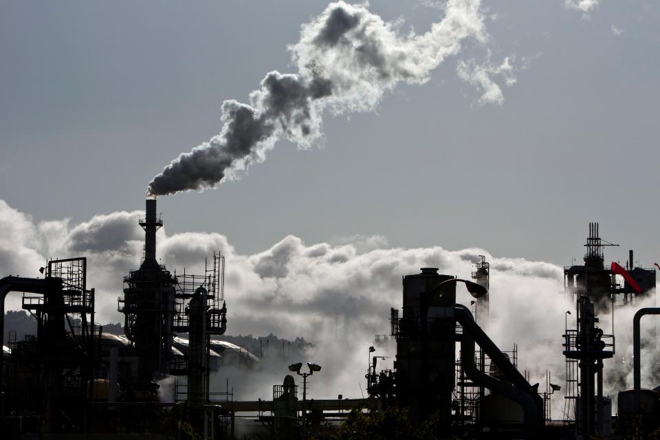 Image: Smoke is released into the sky at an oil refinery in Wilmington (Bret Hartman / Reuters)