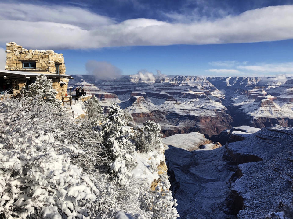 This Tuesday, Jan. 1, 2019, photo shows Lookout Studio in Grand Canyon Village on the South Rim of Grand Canyon National Park in Arizona. While parts of the national park were closed due to the partial government shutdown, much of the park's South Rim was open and accessible. (AP Photo/Anna Johnson)