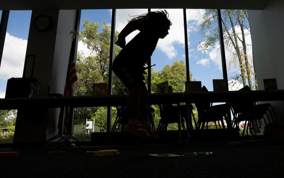 Addison Leslie, 5, dances to a song with Librarian Sarah Mackey during Family Story Hour on Sept. 13 at the Gahanna Branch of the Columbus Metropolitan Library.