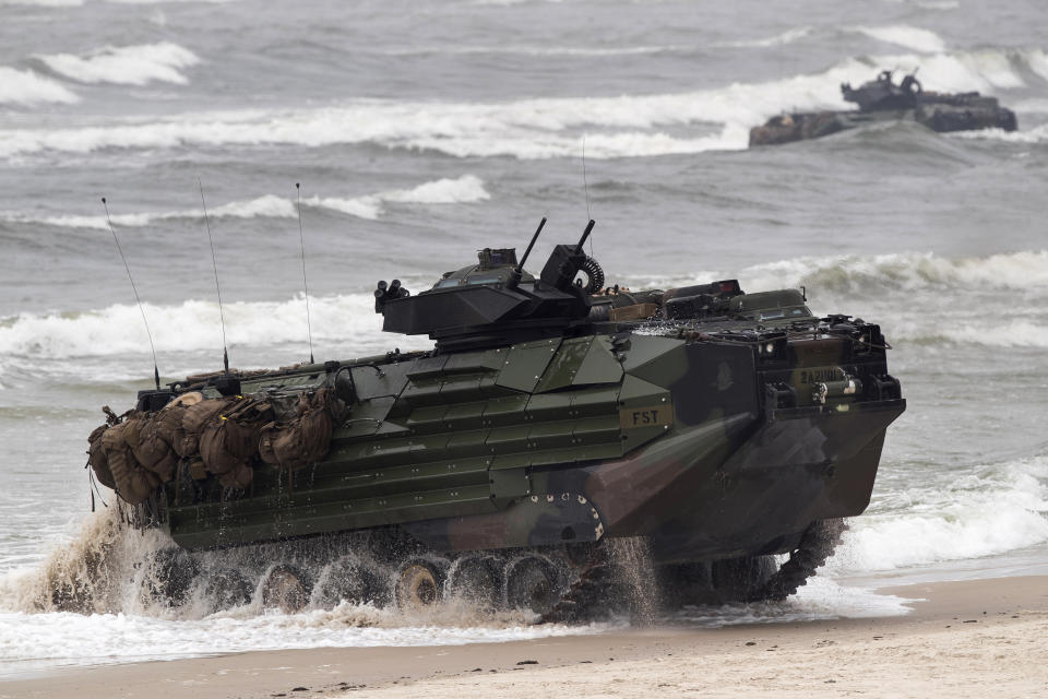 FILE - A U.S. Marine Amphibious Assault Vehicle (AAV) takes part in a landing operation during a military Exercise Baltops 2018, at the Baltic Sea near Vilnius, Lithuania, Monday, June 4, 2018. A training accident off the coast of Southern California in an AAV similar to this one has taken the life of one Marine, injured two others and left eight missing Thursday, July 30, 2020. In a Friday morning tweet, the Marines say the accident happened Thursday and search and rescue efforts are underway with support from the Navy and Coast Guard. (AP Photo/Mindaugas Kulbis, File)