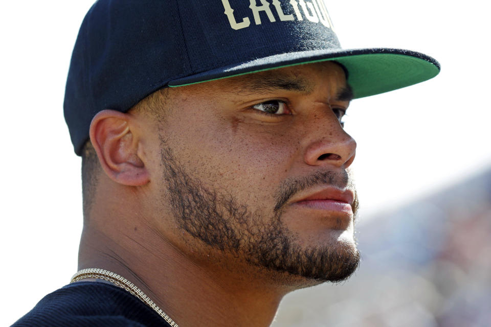 Dallas Cowboy quarterback Dak Prescott, a former Mississippi State player, watches the NCAA college football team's Maroon and White spring game, Saturday, April 8, 2017, in Starkville, Miss. (AP Photo/Rogelio V. Solis)