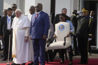 Pope Francis, left, arrives with President of the Democratic Republic of the Congo Felix-Antoine Tshisekedi Tshilombo for a welcome ceremony at the "Palais de la Nation" in Kinshasa, Democratic Republic of the Congo, Tuesday, Jan. 31, 2023. Pope Francis starts his six-day pastoral visit to Congo and South Sudan where he'll bring a message of peace to countries riven by poverty and conflict. (AP Photo/Gregorio Borgia)