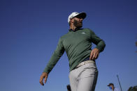 Dustin Johnson walks to the range during practice for the Masters golf tournament on Monday, April 5, 2021, in Augusta, Ga. (AP Photo/David J. Phillip)