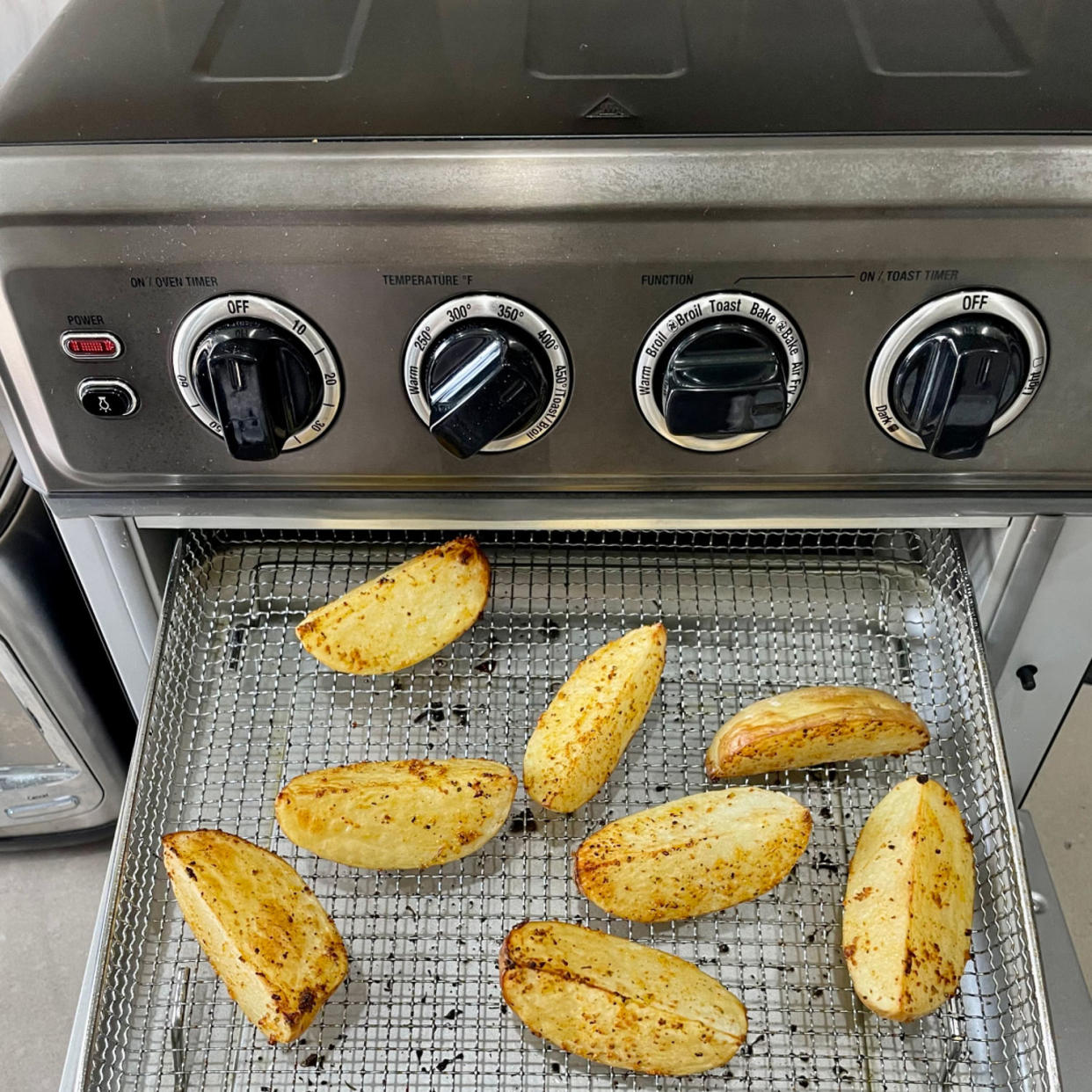 Diced potatoes roasted on the basket tray in the Cuisinart air fryer. (Courtesy of Cory Fernandez)
