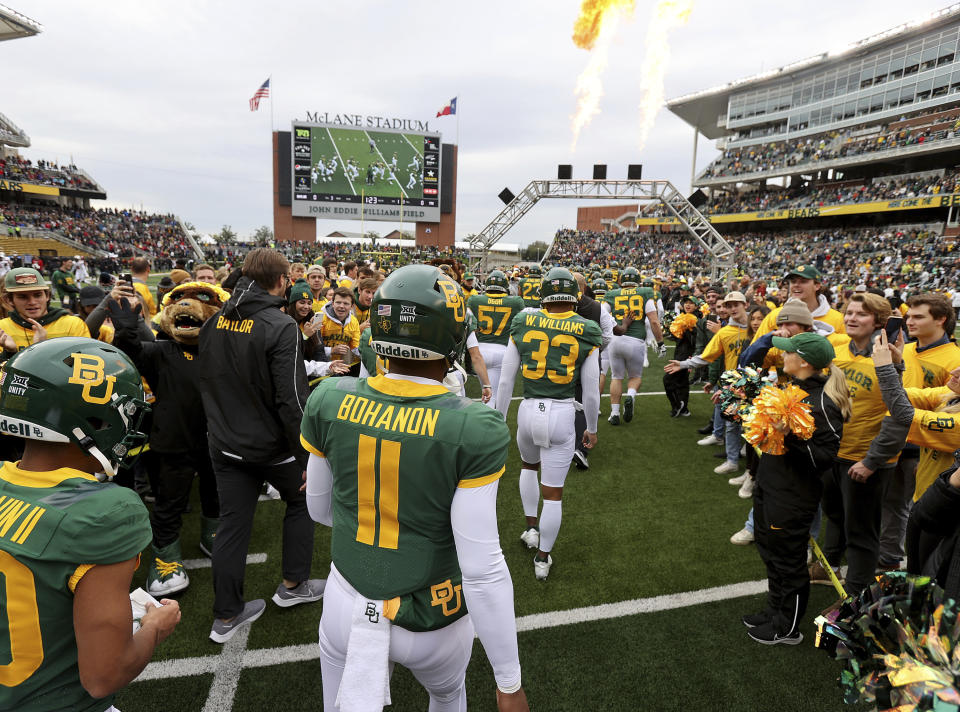 Baylor quarterback Gerry Bohanon head onto the field before an NCAA college football game against Texas Tech, Saturday, Nov. 27, 2021, in Waco, Texas. (AP Photo/Jerry Larson)