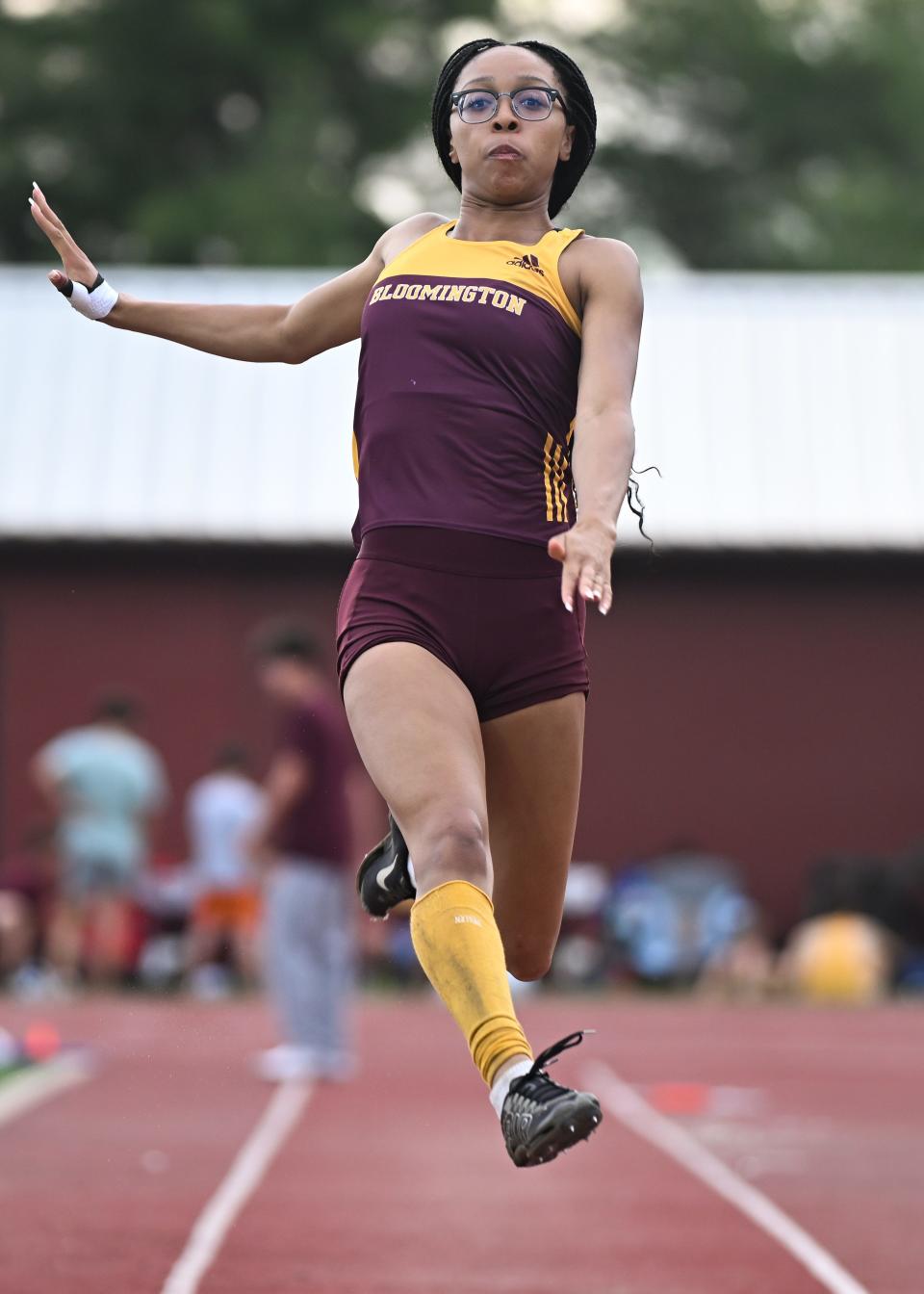 Bloomington North’s Dede Eberle competes in the long jump during the track meet against Bloomington South at North on Wednesday, May 1, 2024.