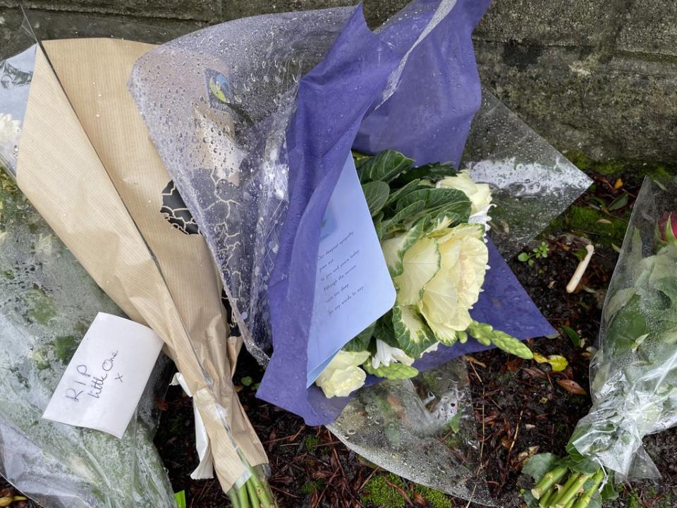 Flowers left outside the house in Pentwyn, Penyrheol, near Caerphilly (PA) (PA Wire)