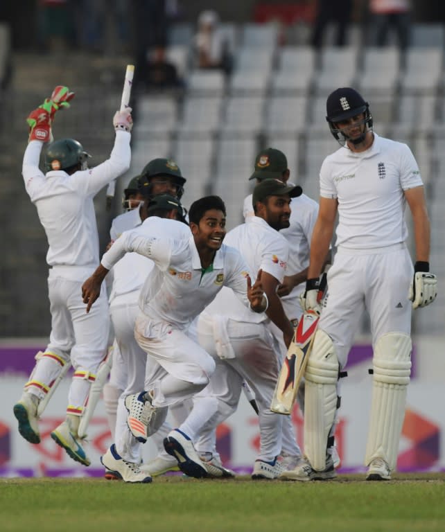 Bangladesh's Mehedi Hasan (C) celebrates with teammates after Bangladesh's victory over England on the third day of the second Test at the Sher-e-Bangla National Cricket Stadium in Dhaka on October 30, 2016