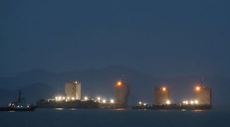 Barges are seen during a salvage operation of sunken ferry Sewol at the sea off Jindo, South Korea, March 22, 2017. Yonhap via REUTERS