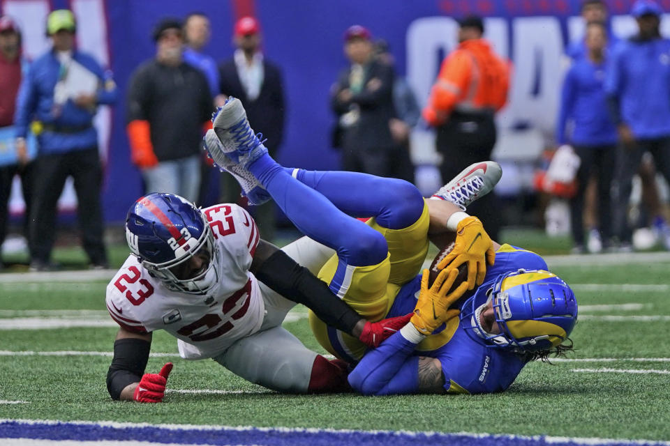 New York Giants' Logan Ryan, left, tackles Los Angeles Rams' Tyler Higbee during the first half of an NFL football game, Sunday, Oct. 17, 2021, in East Rutherford, N.J. (AP Photo/Frank Franklin II)