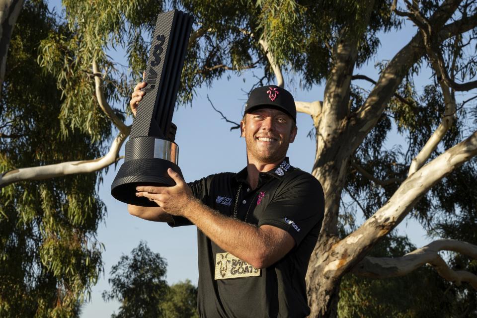 First-place individual champion Talor Gooch, of RangeGoats GC, poses for a photo with the trophy after the final round of LIV Golf Adelaide at the Grange Golf Club, Sunday, April 23, 2023, in Adelaide, Australia. (Photo by Montana Pritchard/LIV Golf via AP)