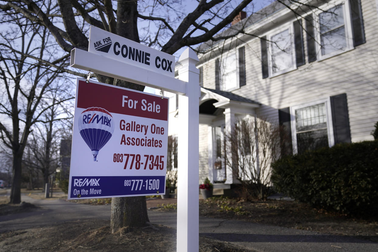 A sign announcing a house for sale is posted outside a single family home, Tuesday, Feb. 7, 2023, in Exeter, N.H. On Thursday, Freddie Mac reports on this week's average U.S. mortgage rates. (AP Photo/Charles Krupa)