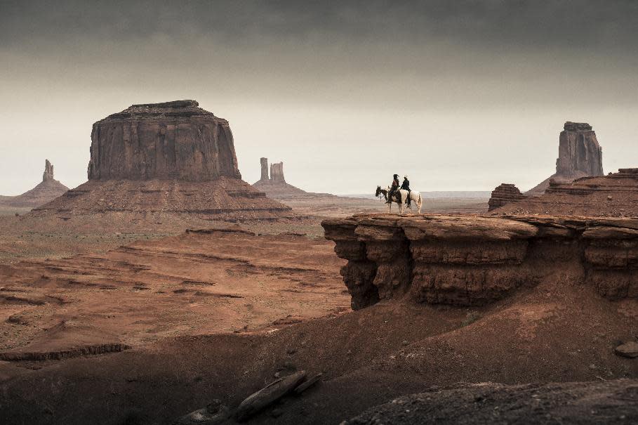 This film publicity image released by Disney shows Johnny Depp as Tonto, left, and Armie Hammer as The Lone Ranger, in a scene from "The Lone Ranger." (AP Photo/Disney Enterprises, Inc., Peter Mountain)