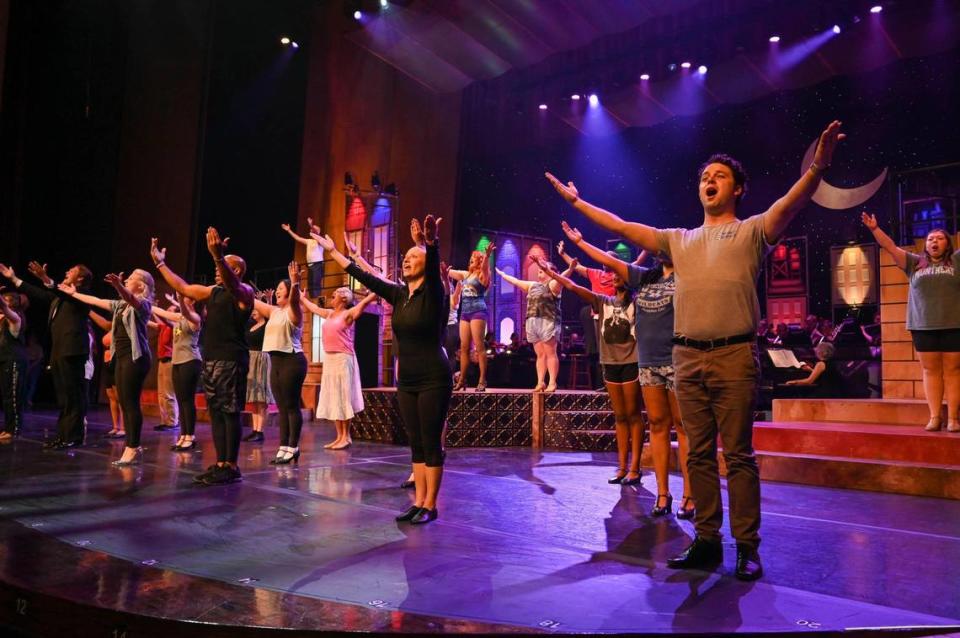 The cast of more than 30 people practices the opening number, “New York, New York,” for the University of Kentucky Opera Theatre’s 31st edition of its “Grand Night for Singing.” The Broadway show tune and pop song revue is at the UK Singletary Center for the Arts.