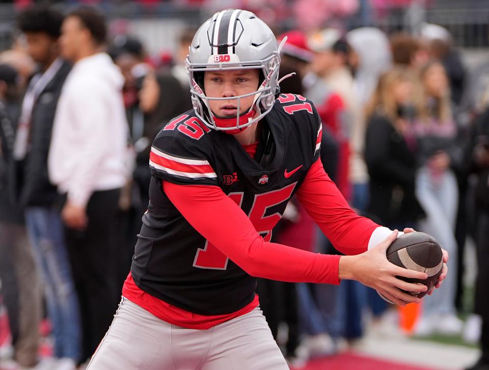 Ohio State Buckeyes quarterback Devin Brown (15) simulates a handoff during the spring football game at Ohio Stadium in Columbus on April 16, 2022.