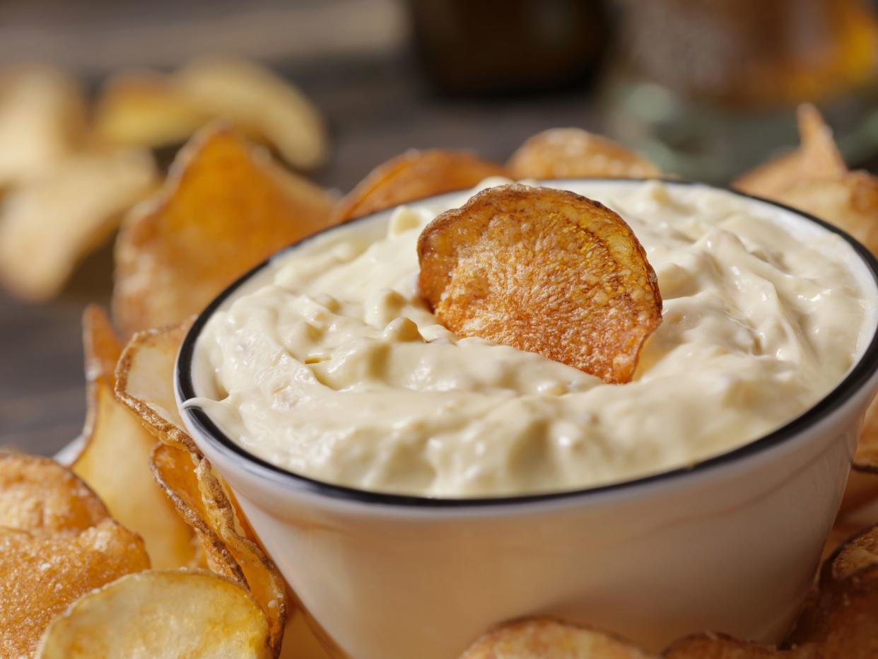 French onion dip with handmade potato chips and a beer