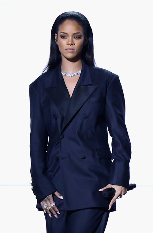 Singing her collaboration with Paul McCartney and Kanye West for the first time live, Rihanna rung in the occasion in a custom John Galliano for Margiela suit. The navy blue oversized blazer, worn without a bra, and wide-leg trousers, was surprisingly sexy.