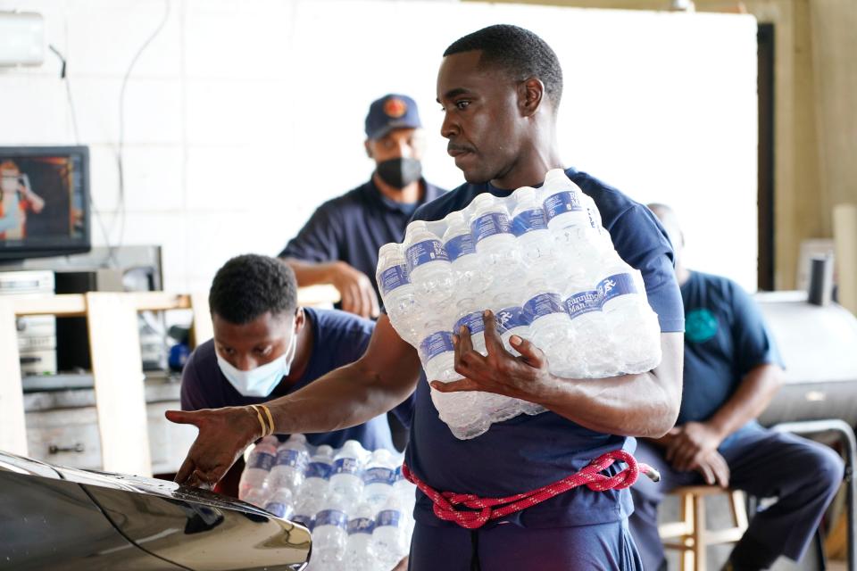 Passing out water to residents of Jackson, Miss., on Aug. 18, 2022.