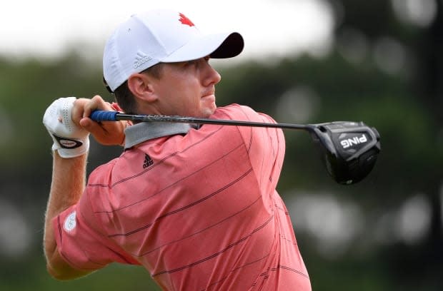 Mackenzie Hughes of Canada plays his second round in the men's Olympic golf tournament at Kasumigaseki Country Club.  (Toby Melville/Reuters - image credit)