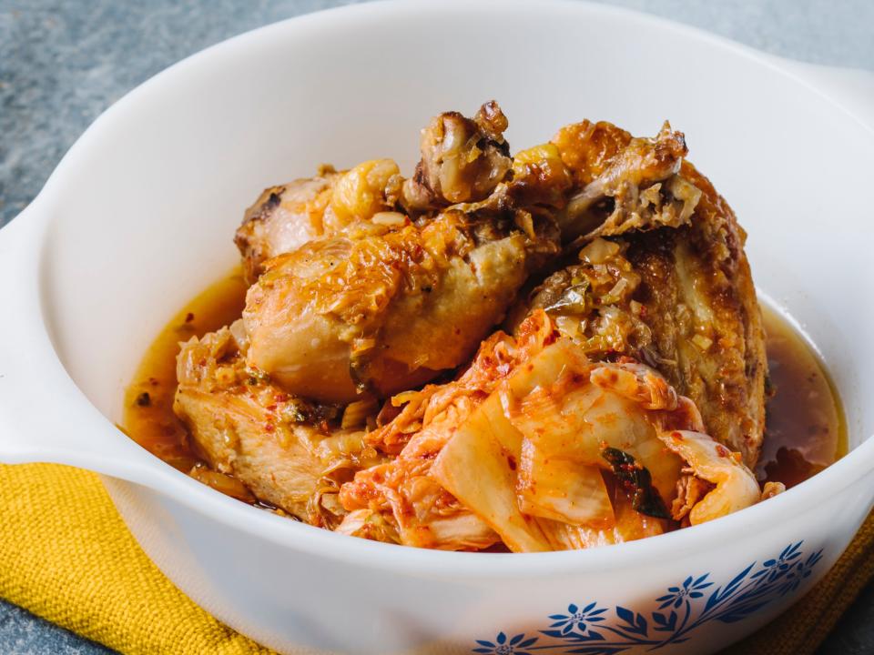 Kimchi Braised Chicken in a white bowl