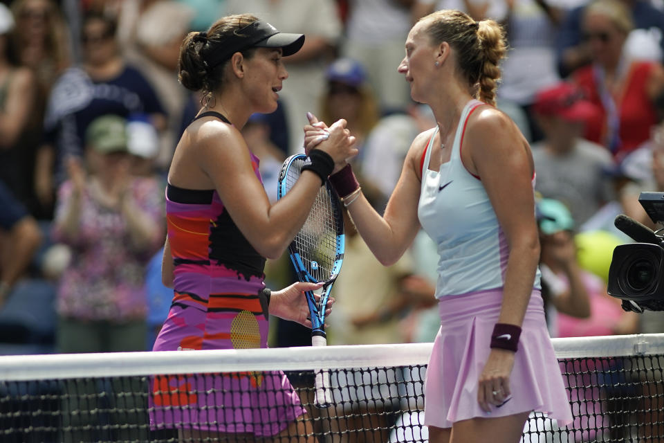 Garbine Muguruza, of Spain, and Petra Kvitova, of the Czech Republic, shake hands after Kvitova won their third-round match of the U.S. Open tennis championships, Saturday, Sept. 3, 2022, in New York. (AP Photo/Eduardo Munoz Alvarez)