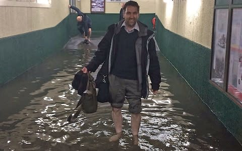 Some commuters were prepared for flooding at Carnforth station in Lancashire - Credit: Bloo_Bel/PA