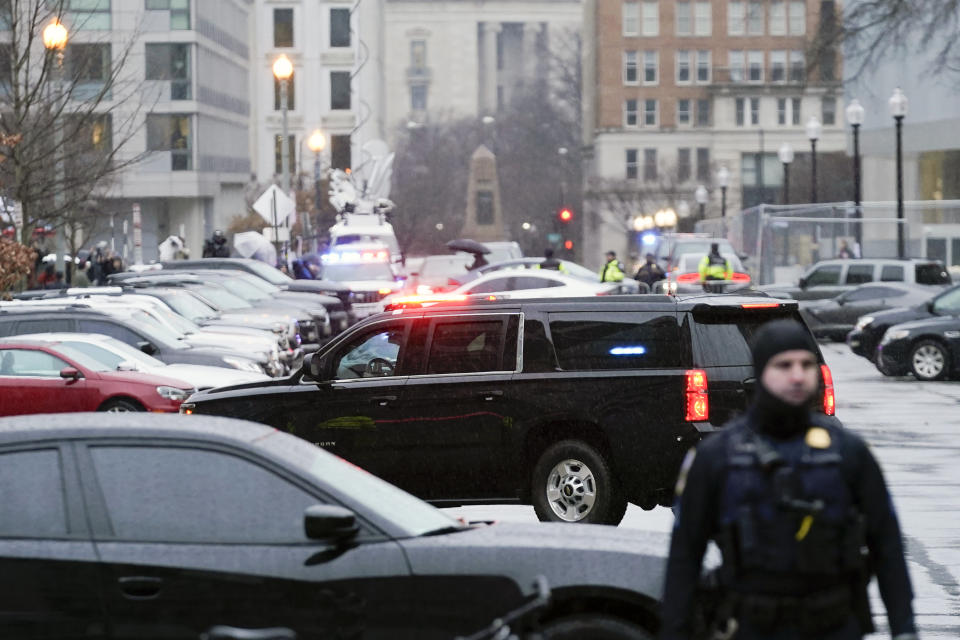 The motorcade carrying former President Donald Trump arrives at the E. Barrett Prettyman U.S. Federal Courthouse, Tuesday, Jan. 9, 2024, in Washington. (AP Photo/Jose Luis Magana)