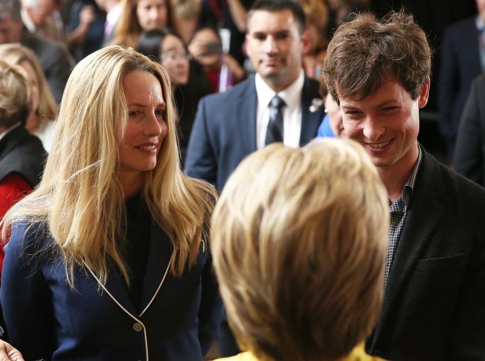 Hillary Clinton greets Laurene Powell (L) widow of Steve Jobs, and her son Reed Jobs after delivering a counterterrorism address at Stanford University on March 23, 2016 in Stanford, California