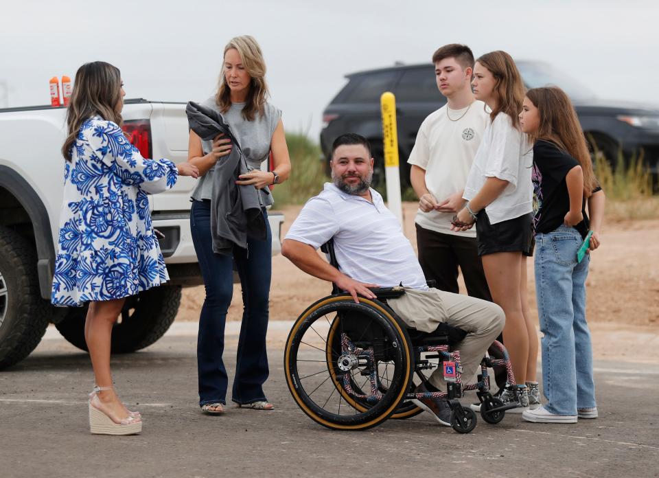 From left, West Texas Homebuilders Association's Clarissa Sanchez, Jason's wife Michelle, Jason Lilley and his children 18-year-old Austin, 17-year-old Mackenzie, and 12-year-old Madison look on. West Texas Hero Homes held a ground breaking ceremony in Wolfforth Monday, Sept. 25, 2023, to build a home for U.S. Marine Corps Sergeant Jason Lilley and his family.