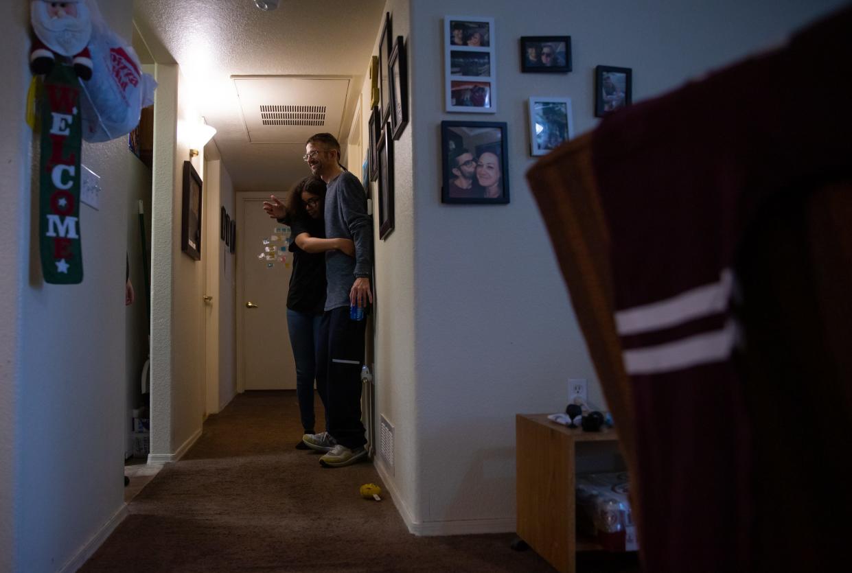 Jason Edwards (right) and his daughter Zoey Edwards, 16, in their apartment in Marana, Arizona. Their apartment complex is in the process of being converted from low-income housing to market rate.