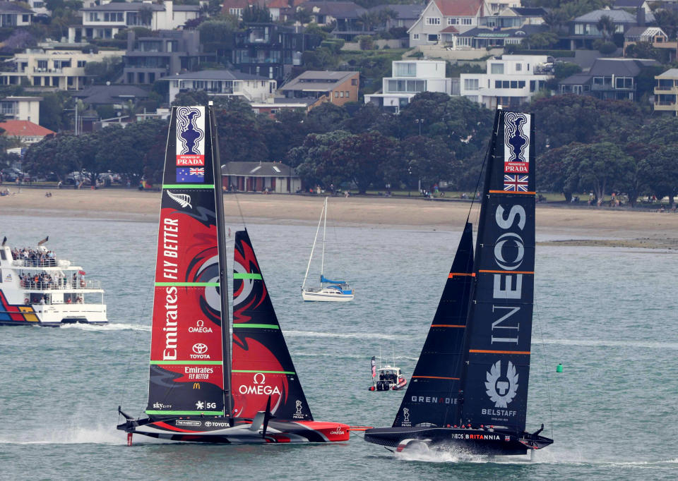 Team New Zealand yacht, left, and Britain's Team UK compete in the America's Cup World Series on the Hauraki Gulf off Auckland, New Zealand, Friday, Dec. 18, 2020. (New Zealand Herald via AP)