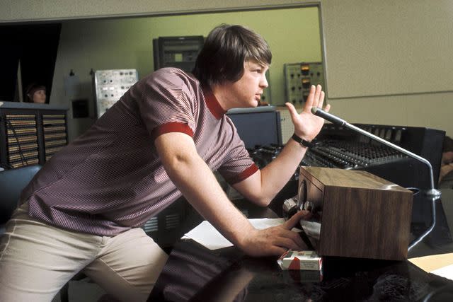 <p>Michael Ochs Archives/Getty Images</p> LOS ANGELES - 1966: Singer and mastermind Brian Wilson of the rock and roll band "The Beach Boys" directs from the control room while recording the album "Pet Sounds" in 1966 in Los Angeles, California. (Photo by Michael Ochs Archives/Getty Images)