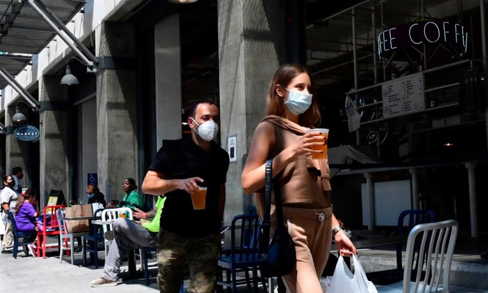 People enjoy outdoor dining in Los Angeles. New measures are ordering restaurants to close again.