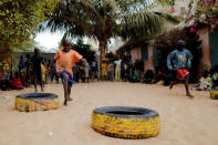 Bassirou Toure, 6, a Koran student, called a talibe, takes part in an entertainment program in the courtyard of Maison de la Gare, an organisation that helps talibe street children reintegrate into society, in Saint-Louis, Senegal, February 7, 2019. REUTERS/Zohra Bensemra